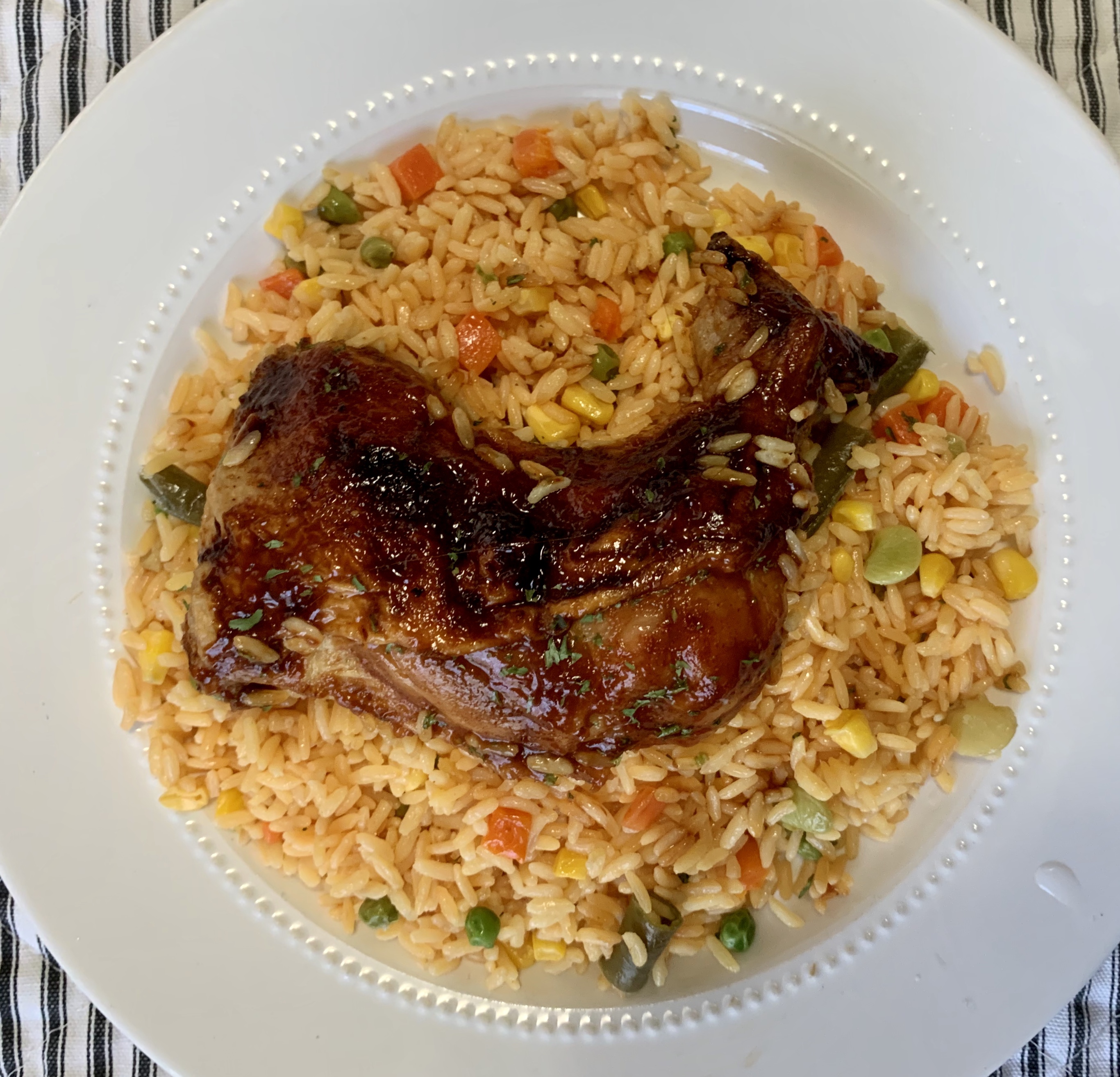 Barbecue Chicken Legs Over Yellow Rice